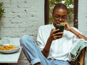 woman-on-phone-at-table