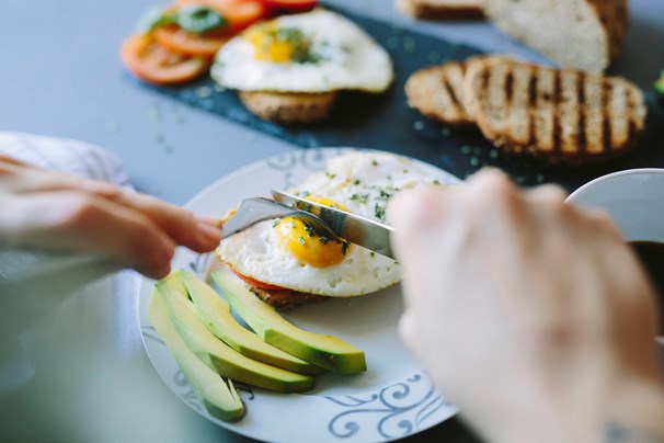 woman eating eggs